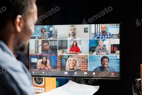 Preview: Young manager attending videocall with employees team