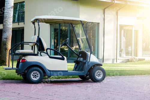 Preview: White golf cart is parked near the modern cottage house