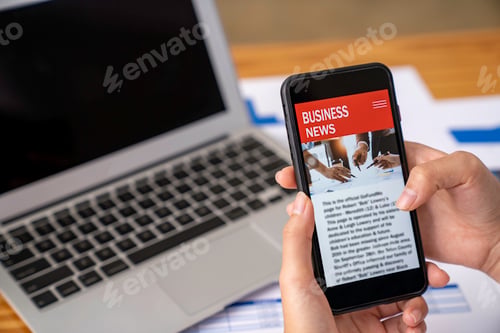 Preview: business woman using a mobile phone in the office to update financial investment news and analysis o