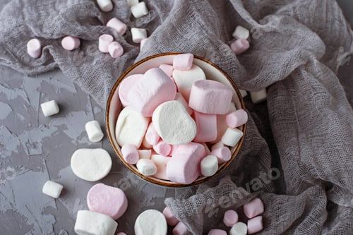 Preview: White and pink marshmallows on gray concrete background