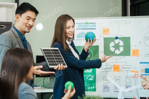 Preview: Diverse team, middle-aged Asian businessman, Caucasian young businesswoman, Muslim hijab-wearing