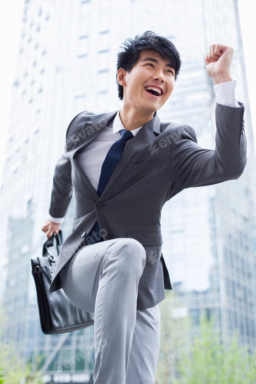 Preview: Running Chinese businessman with briefcase in hand