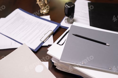 Preview: Stack of juridical documents in folders and clipboards