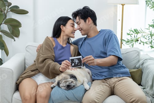 Preview: Couple Sharing Ultrasound Picture at Home