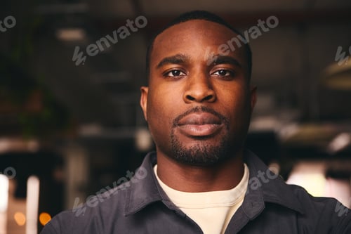 Preview: Confident Young Black Male Standing In Office Looking At Camera
