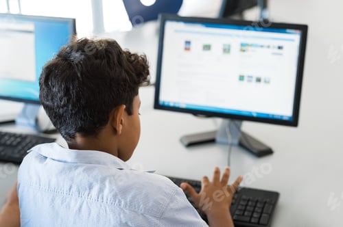 Preview: Young boy using computer