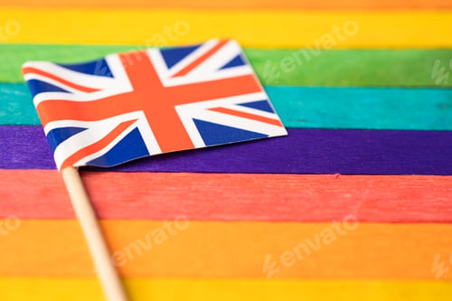Preview: United Kingdom flag on rainbow background symbol of LGBT gay pride month social movement rainbow
