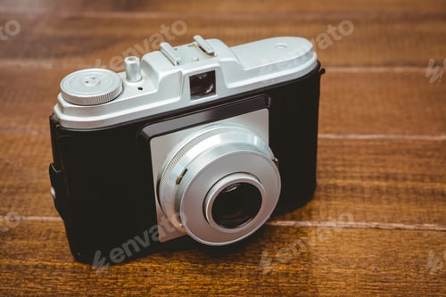 Preview: View of an old camera on wood desk