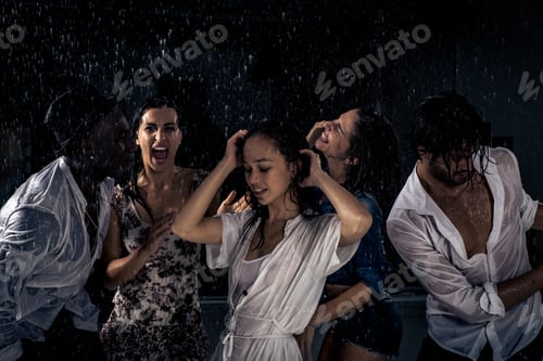 Preview: Group of friends dancing in the rain