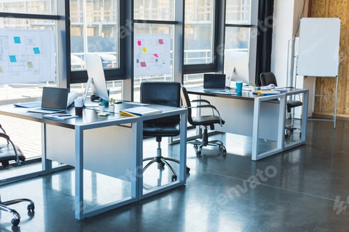 Preview: working tables with computers and laptops in business office