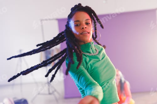 Preview: Image of happy afican american female hip hop dancer in studio