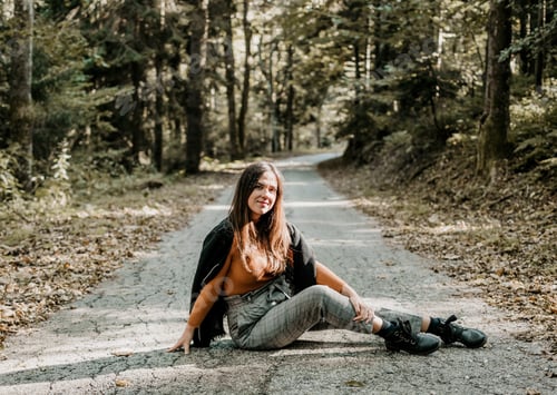 Preview: Shot of a beautiful woman sitting in an autumn forest