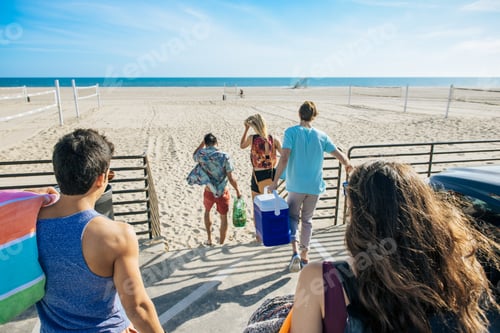 Preview: Group of friends, walking towards beach, rear view