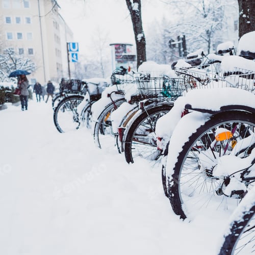 Preview: Bicycles in snow near houses