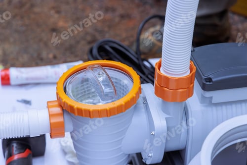 Preview: View of pool pump installation process with focus on fittings components in outdoor setting