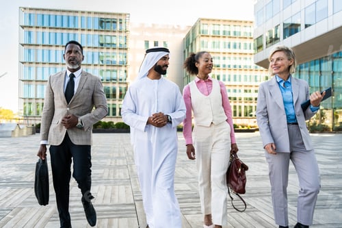 Preview: Group of multiethnic business people meeting an emirati businessman