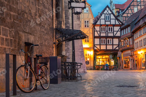 Preview: Charming Quedlinburg town evening street view illuminated with lights old St. Nicholas Church