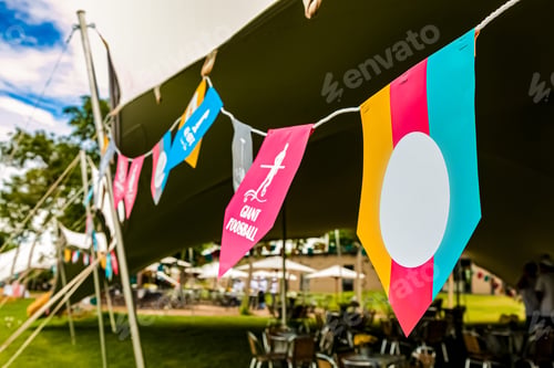 Preview: Paper bunting strings attached to tents for outdoor party
