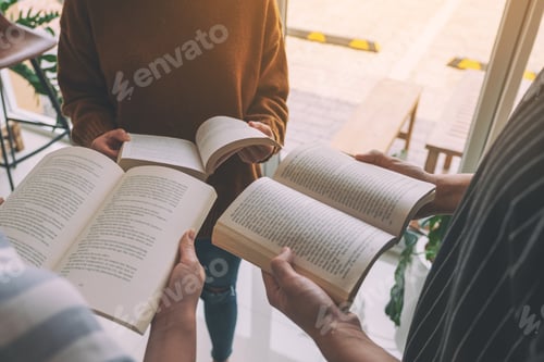 Preview: Three young people standing in circle and enjoyed reading books together