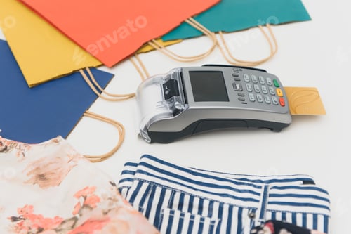 Preview: credit card swiping machine to pay. credit card payment through a shopping terminal.