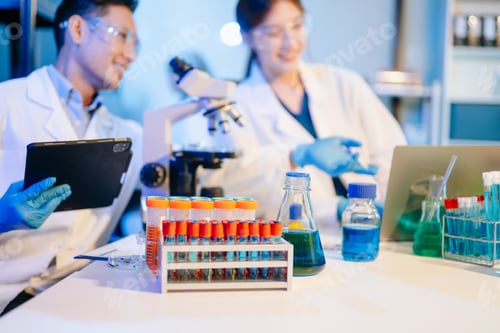 Preview: Scientist team meeting and writing analysis results in the laboratory study