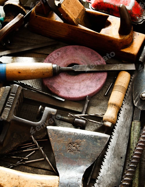 Preview: Many old working tools ( ruler, drill, chisel and others) on a wooden background.