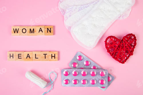 Preview: Sanitary pads, tampons, pills on pink background. Feminine hygiene products for menstruation.