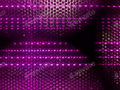 Preview: Pink lights shining through black metal