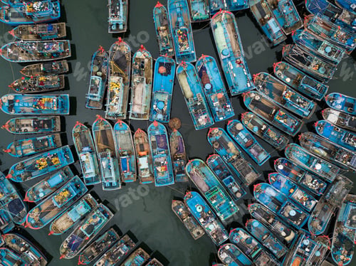 Preview: Aerial shot of a harbour with lots of blue Vietnamese fishing boats