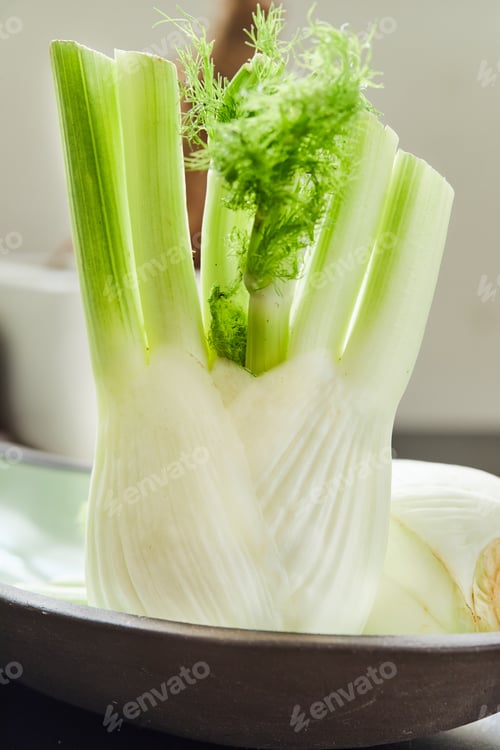 Preview: Fennel in plate ready for cooking in the kitchen