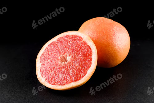 Preview: Grapefruit on black background. Citrus fruit . Healthy freshness food.