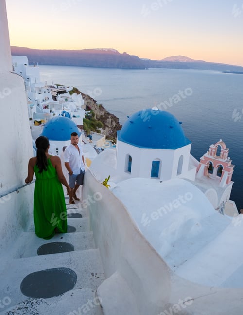 Preview: couple men and woman on vacation Santorini Greece. young couple on vacation in Greece