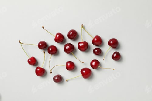 Preview: Ripe juicy cherry fruits on a white background