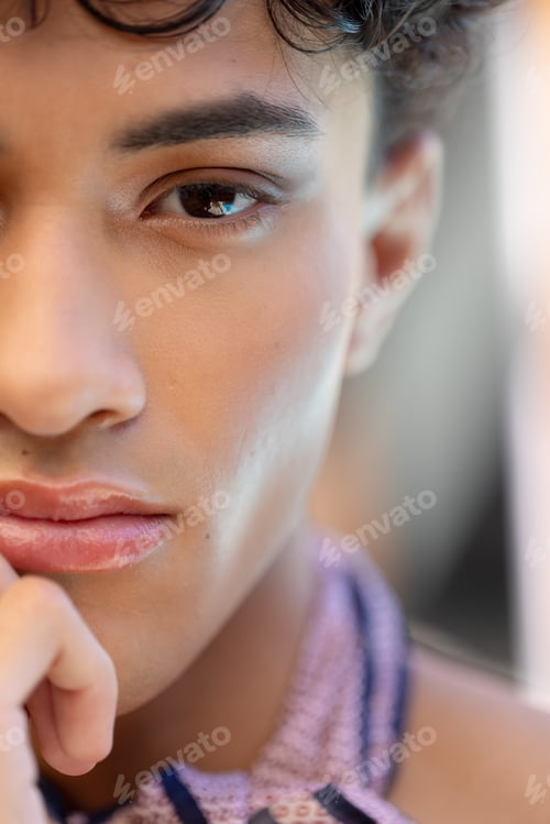 Preview: Close-up of transgender transgender woman with thoughtful expression, wearing patterned scarf