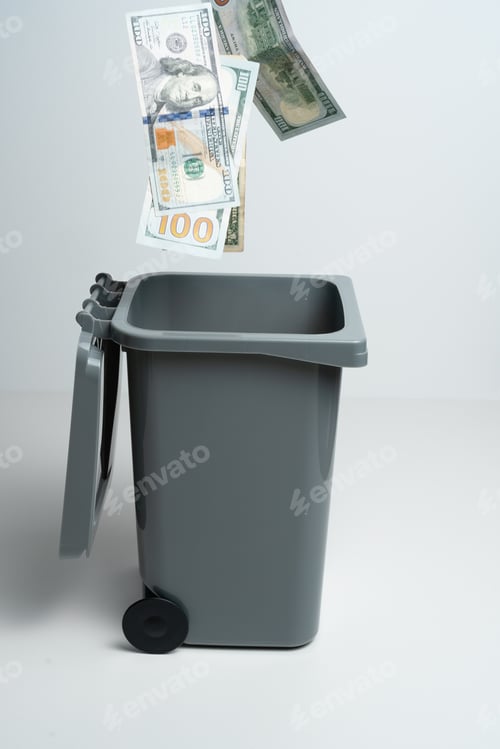 Preview: Flying dollar banknotes in the trash can