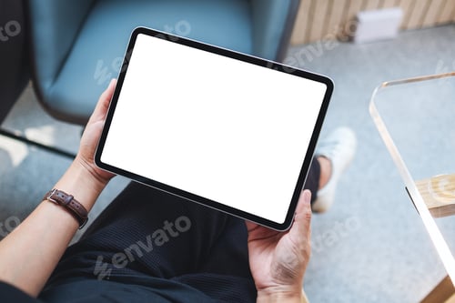 Preview: Top view mockup image of a woman holding digital tablet with blank white desktop screen in cafe