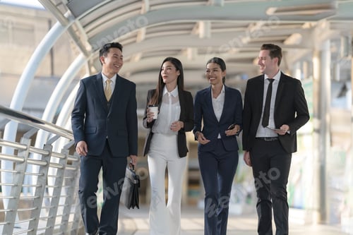Preview: Business people walking and talk to each other in front of modern office