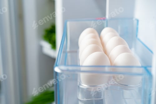 Preview: Pack of eggs on a fridge shelf