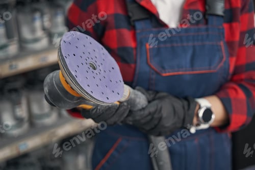 Preview: Close up of mechanic demonstrating instrument for grinding