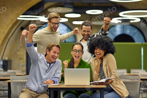 Preview: Group of young happy multiracial business people sitting at desk in the modern office or coworking