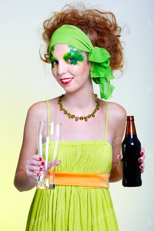 Preview: Portrait Of Beautiful Red-Haired Model With Shamrock Body Art Holding The Glass Of Beer
