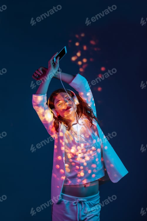 Preview: Woman enjoying music with smartphone