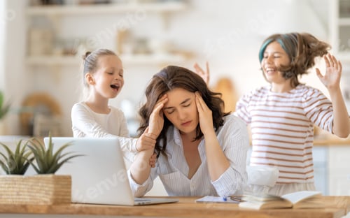Preview: woman working on a laptop at home