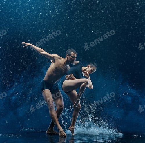 Preview: Young couple of ballet dancers dancing unde rwater drops