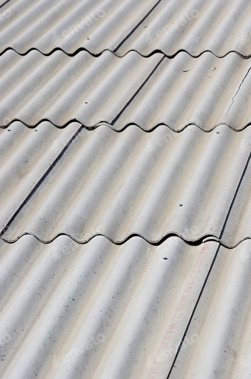 Preview: A fragment of a gray slate roof of an old sample made of asbestos material