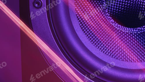 Preview: Closeup detail shot of an acoustic speaker drum with neon light glare