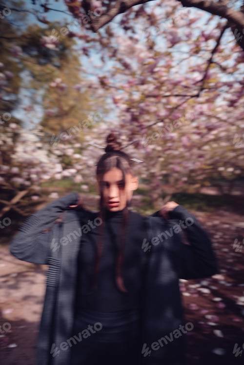 Preview: Beautiful young woman wearing kimono with cherry blossoms, sakura view