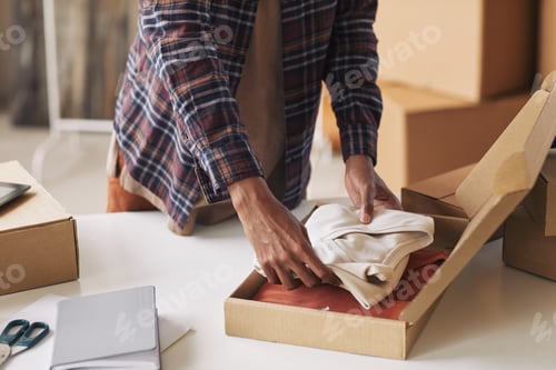 Preview: Man packing parcel