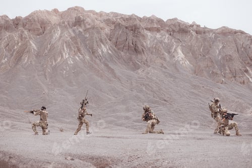 Preview: Soldiers in camouflage military uniforms carrying weapons Reconnaissance missions in rugged mountain