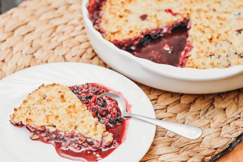 Preview: a piece of berry pie with crunchy top. usingfresh summer berries for baking.